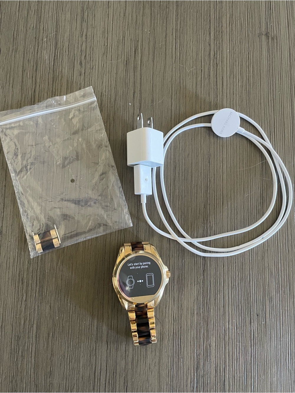 Michael Kors "DW2c" Access Bradshaw Smartwatch with charger and sizing pieces.